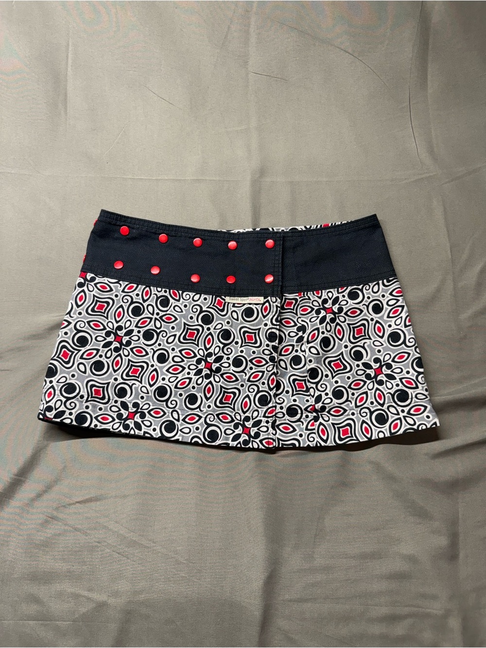 Black and White Geometric Mini Skirt with Red Accents